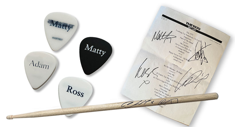 Signed Setlist from the San Diego Still… At Their Vey Best show 30th September 2023, together with Matty, Ross, Adam guitar picks and a show used Drum Stick signed by George.